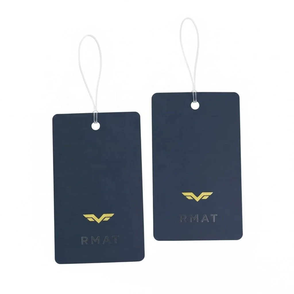 Navy swing tags with a small gold printed detail